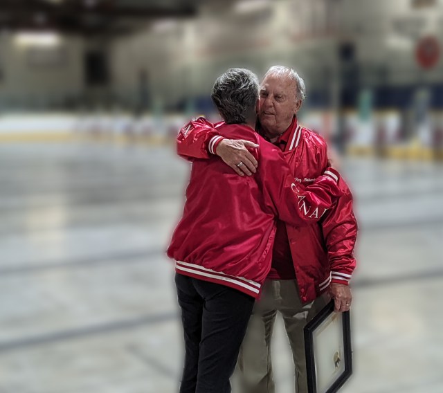 Roy Babcock gets a A well deserved HOF-Hug from Myrna Bilton.